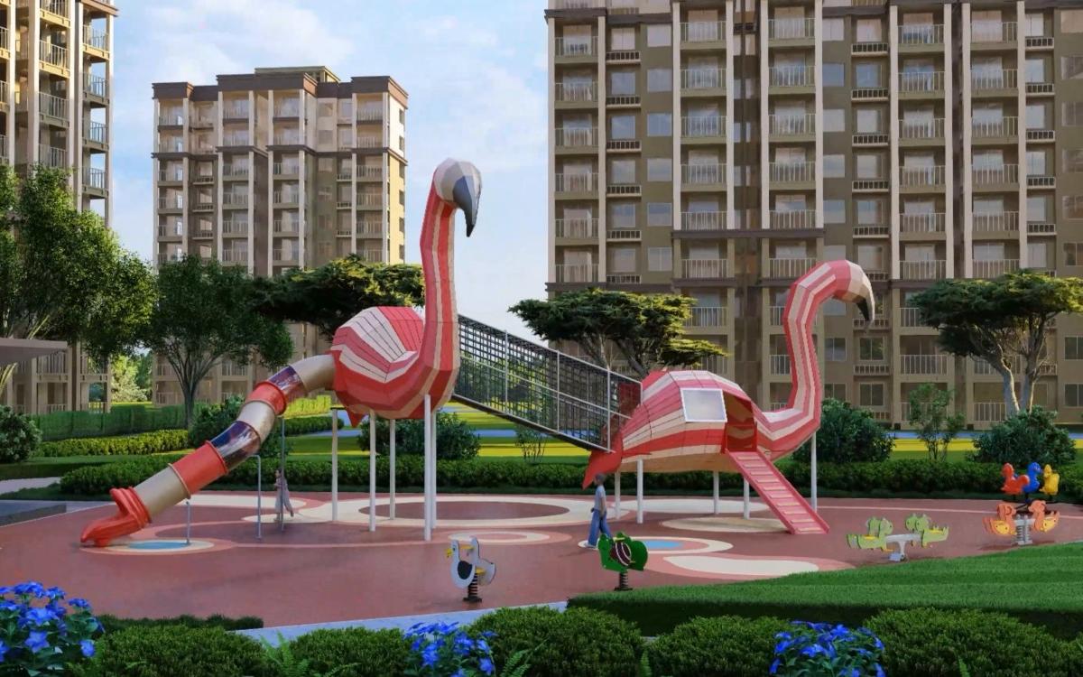 Flamingo Themed Playground side view showing two bird-shaped play structures connected by an elevated net bridge and tube slide